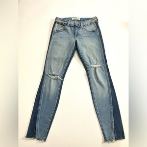 AMO Revolve Twist Two-Tone Distressed Skinny Crop Jeans